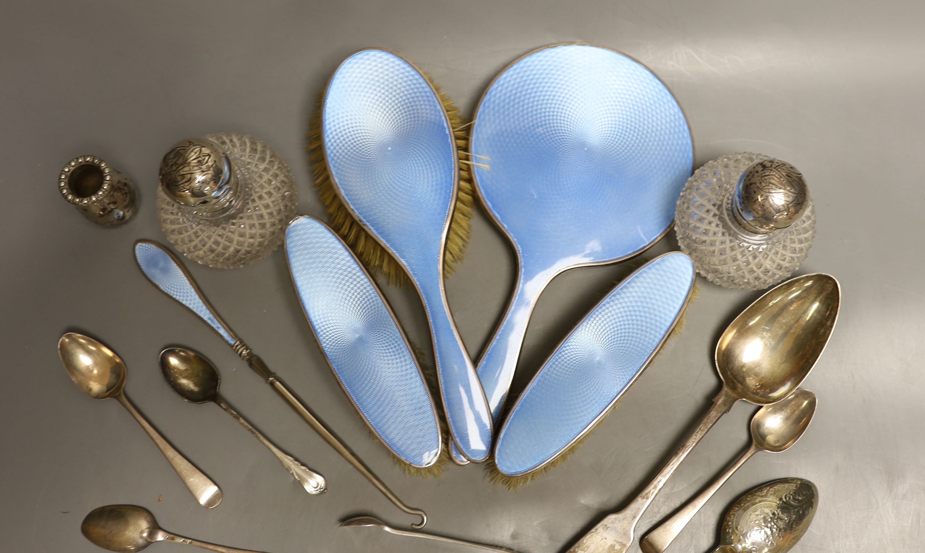 Two silver mounted glass scent bottles, a miniature Scottish silver vase, a five piece silver and guilloche enamelled dressing table set and a small group of assorted silver and sterling flatware